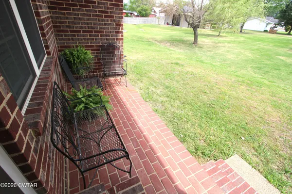 a view of a yard in front of a house with a yard