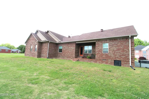 a front view of a house with yard