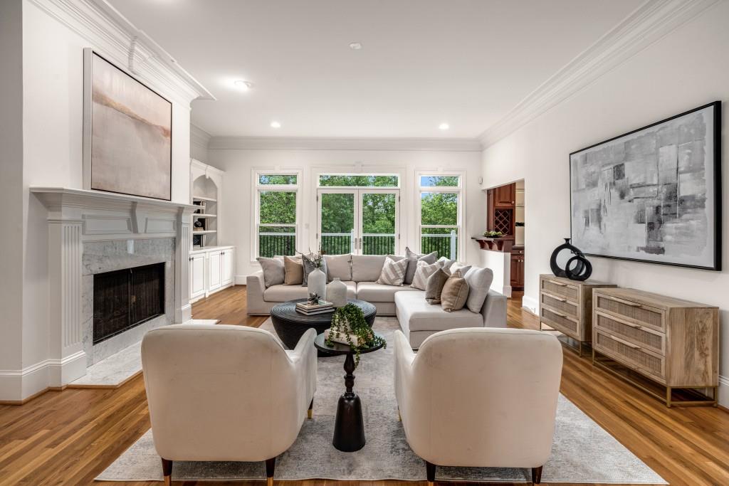 8345 Jett Ferry Road Sandy Springs, GA 30350 - Photo 12 of 61 a living room with fireplace furniture and a large window