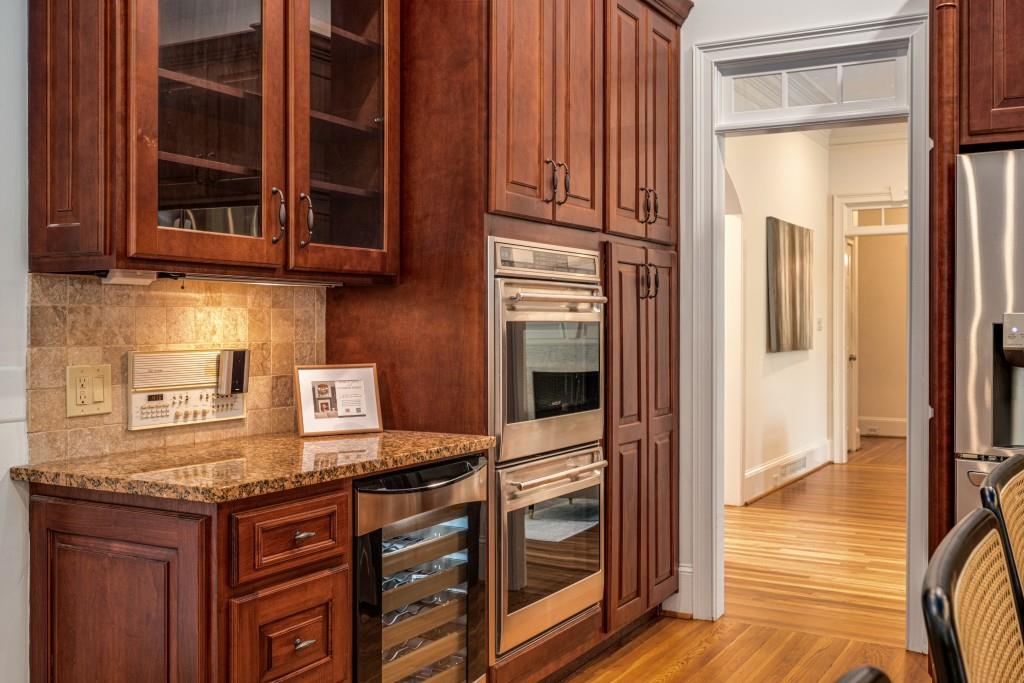 8345 Jett Ferry Road Sandy Springs, GA 30350 - Photo 21 of 61 a kitchen with stainless steel appliances granite countertop a stove and a microwave oven