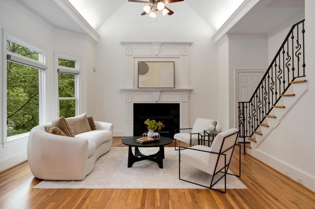 8345 Jett Ferry Road Sandy Springs, GA 30350 - Photo 25 of 61 a living room with furniture and a fireplace