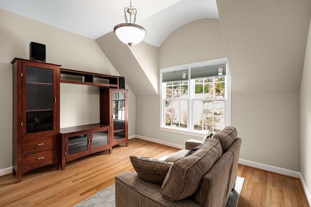 8345 Jett Ferry Road Sandy Springs, GA 30350 - Photo 42 of 61 a living room with furniture and a flat screen tv