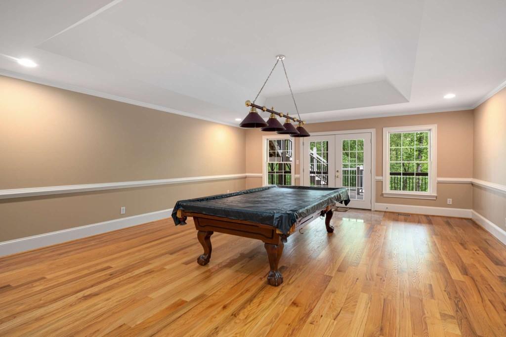 8345 Jett Ferry Road Sandy Springs, GA 30350 - Photo 44 of 61 a room with wooden floor pool table and windows