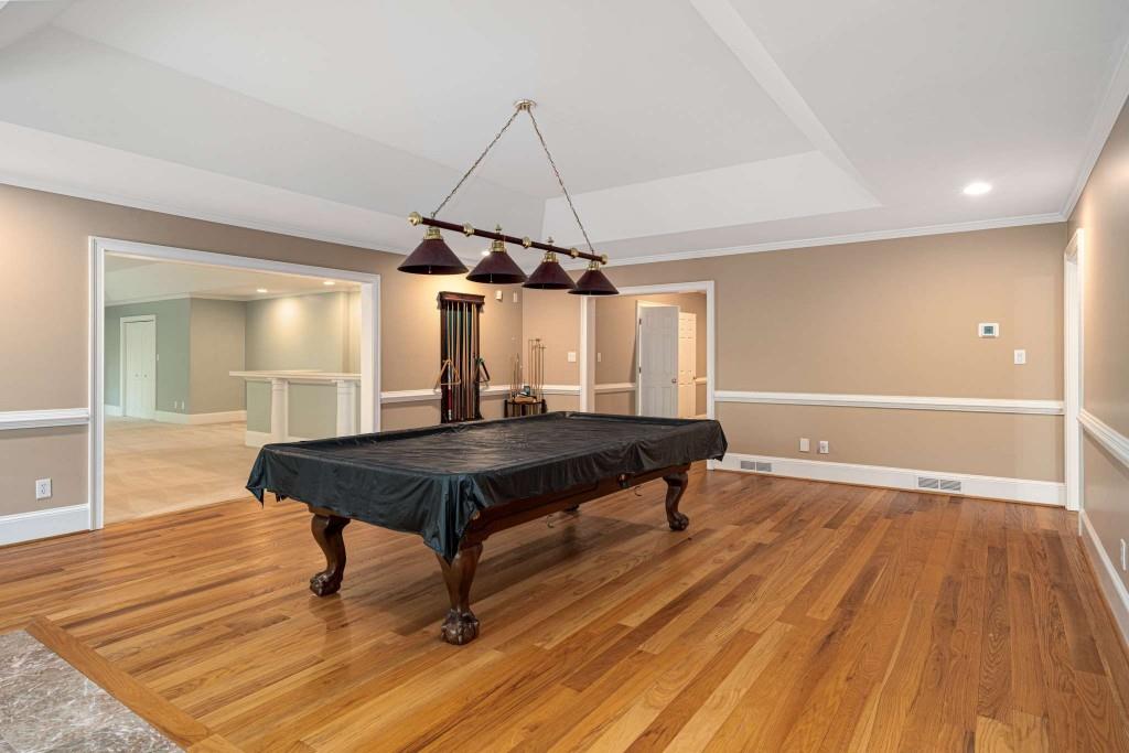 8345 Jett Ferry Road Sandy Springs, GA 30350 - Photo 45 of 61 a room with wooden floor pool table and windows