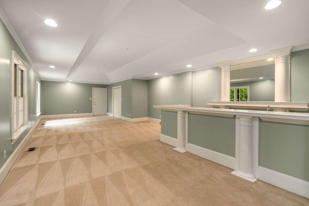 8345 Jett Ferry Road Sandy Springs, GA 30350 - Photo 49 of 61 a large bathroom with a large mirror vanity and a sink