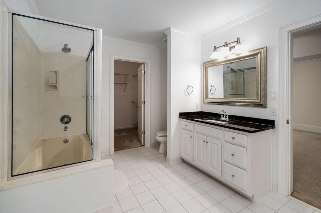 8345 Jett Ferry Road Sandy Springs, GA 30350 - Photo 51 of 61 a kitchen with a sink and a refrigerator