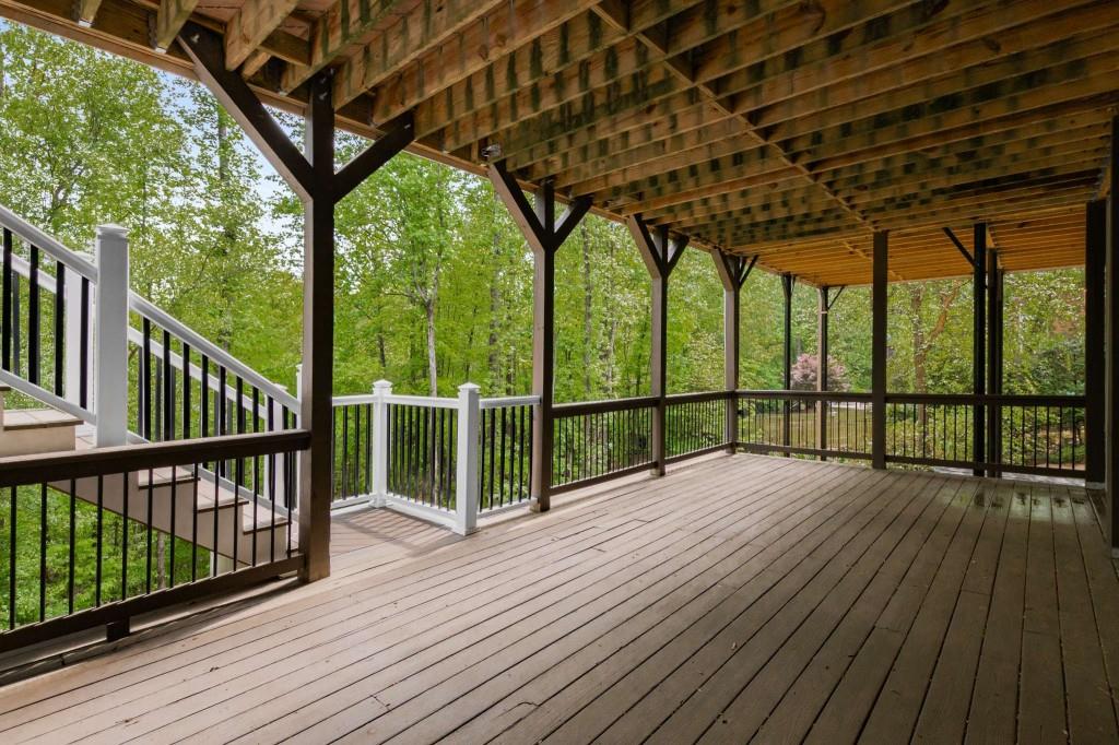 8345 Jett Ferry Road Sandy Springs, GA 30350 - Photo 52 of 61 a view of porch with wooden floor and outdoor space
