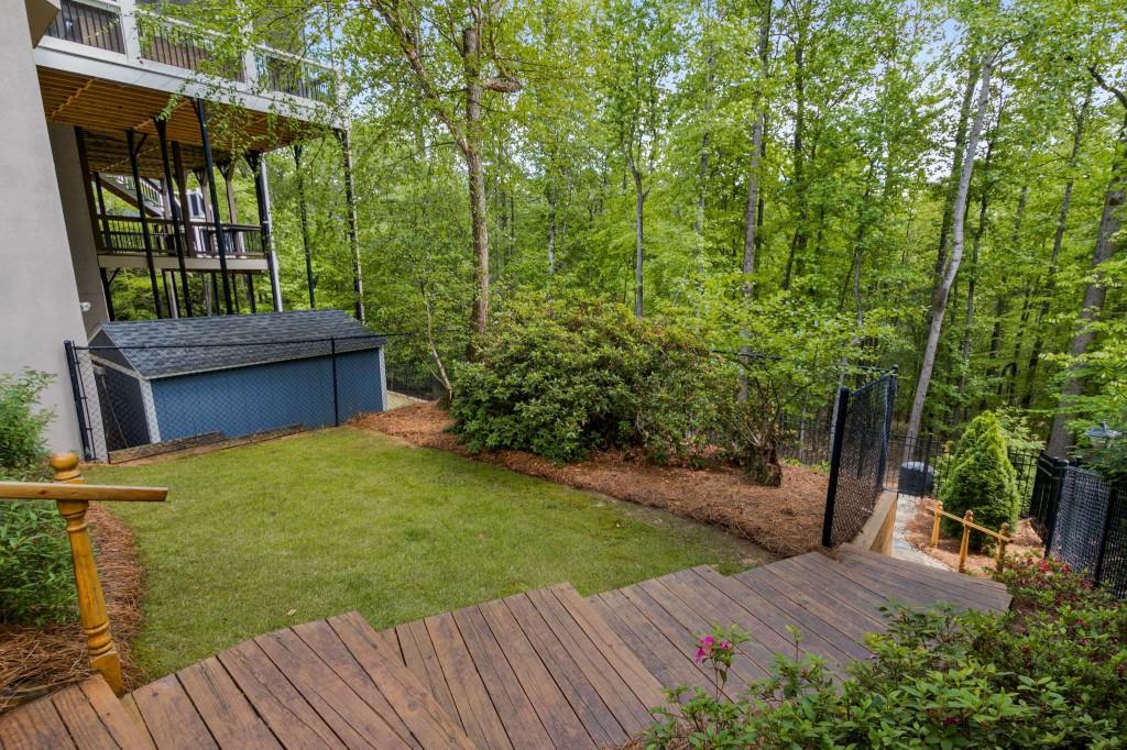 8345 Jett Ferry Road Sandy Springs, GA 30350 - Photo 54 of 61 a view of a backyard with plants