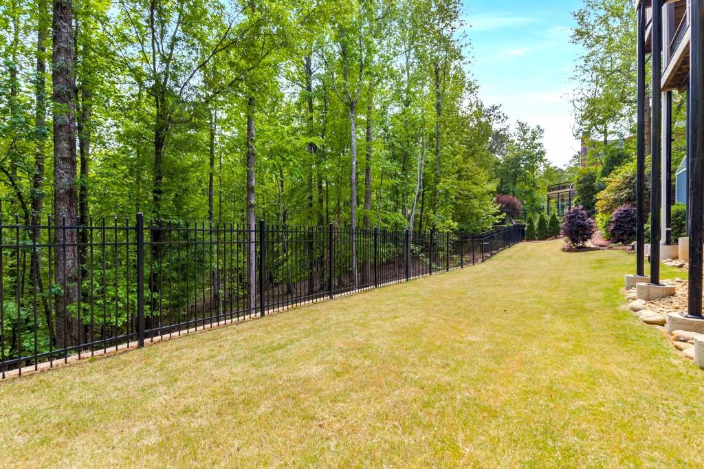 8345 Jett Ferry Road Sandy Springs, GA 30350 - Photo 56 of 61 a view of a yard with large trees