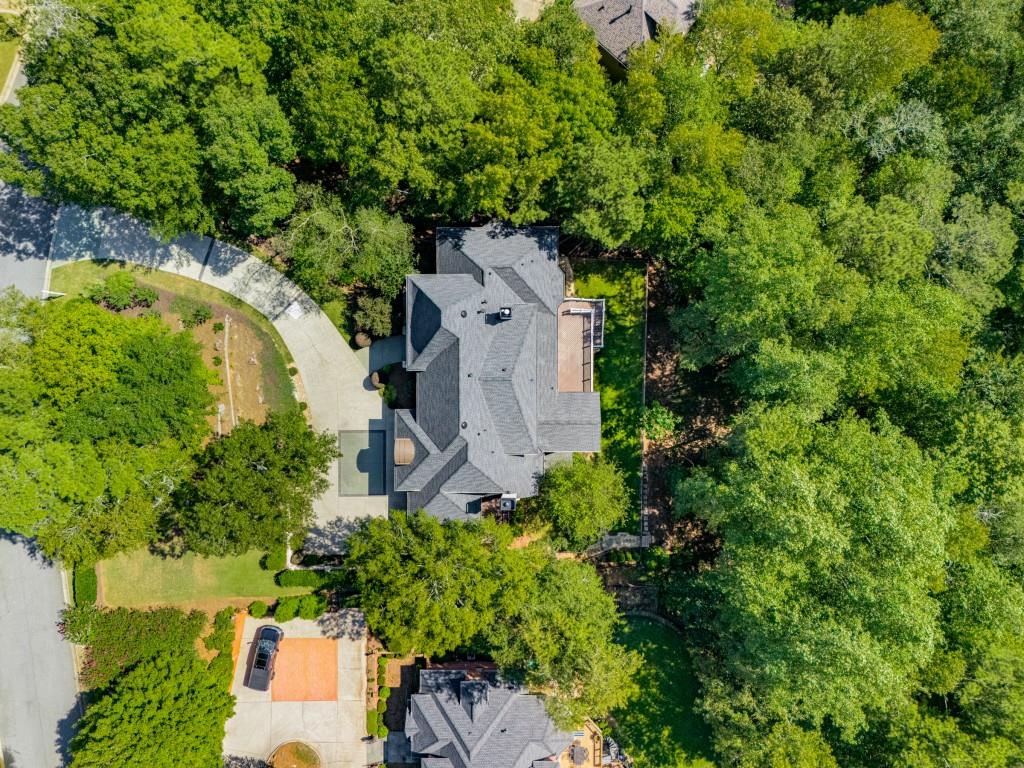 8345 Jett Ferry Road Sandy Springs, GA 30350 - Photo 58 of 61 an aerial view of a house with a yard and trees all around