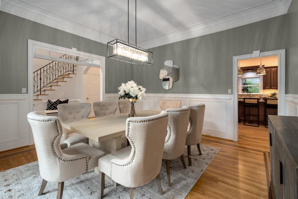 8345 Jett Ferry Road Sandy Springs, GA 30350 - Photo 6 of 61 a dining room with furniture a chandelier and wooden floor