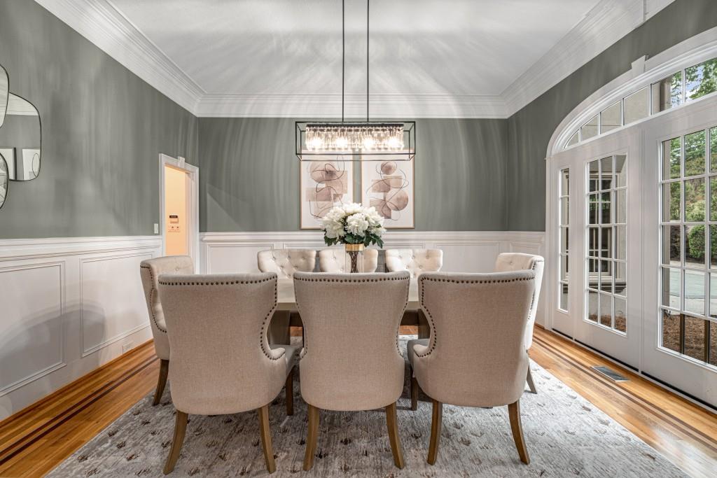 8345 Jett Ferry Road Sandy Springs, GA 30350 - Photo 7 of 61 a view of a dining room with furniture window and wooden floor