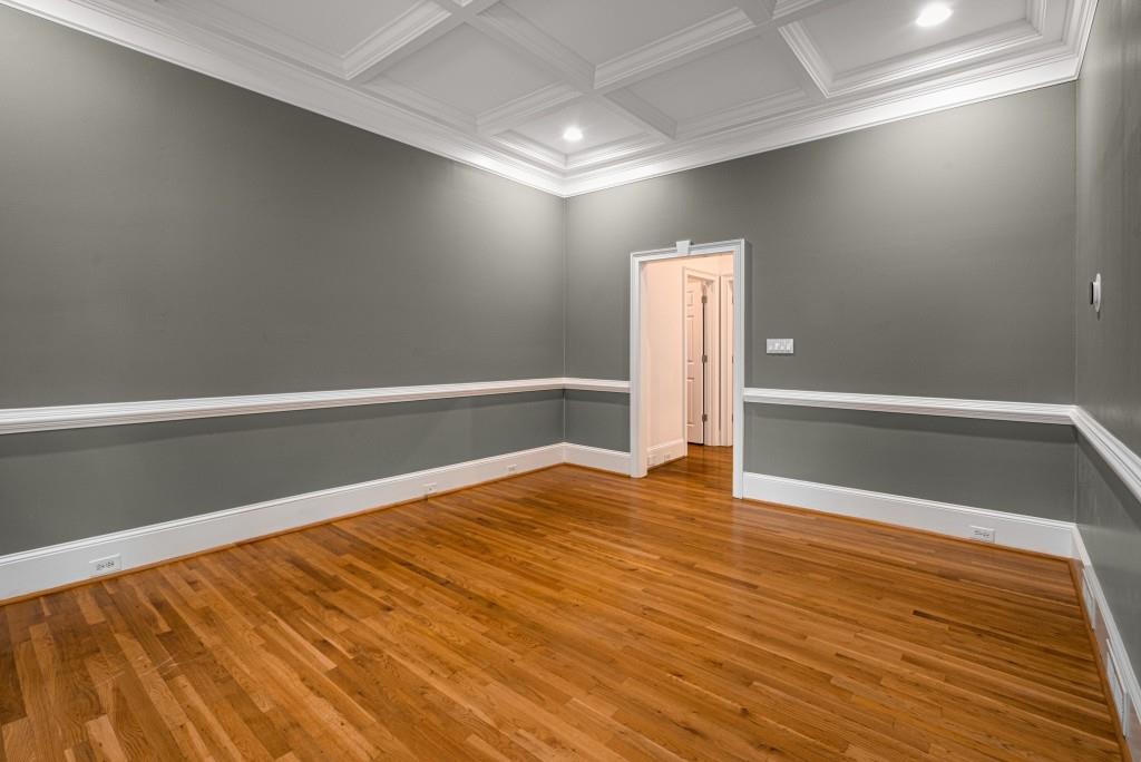 8345 Jett Ferry Road Sandy Springs, GA 30350 - Photo 9 of 61 a view of empty room with wooden floor