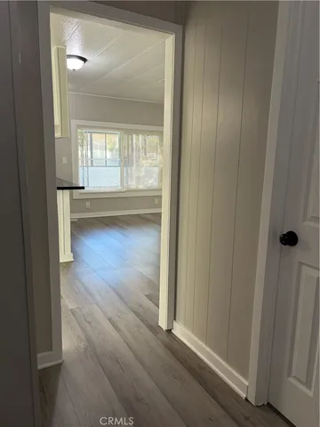 a view of livingroom with hardwood floor and hallway