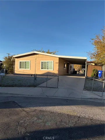 a view of house with car parked