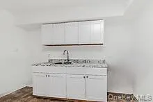 a view of a room with wooden floor and staircase