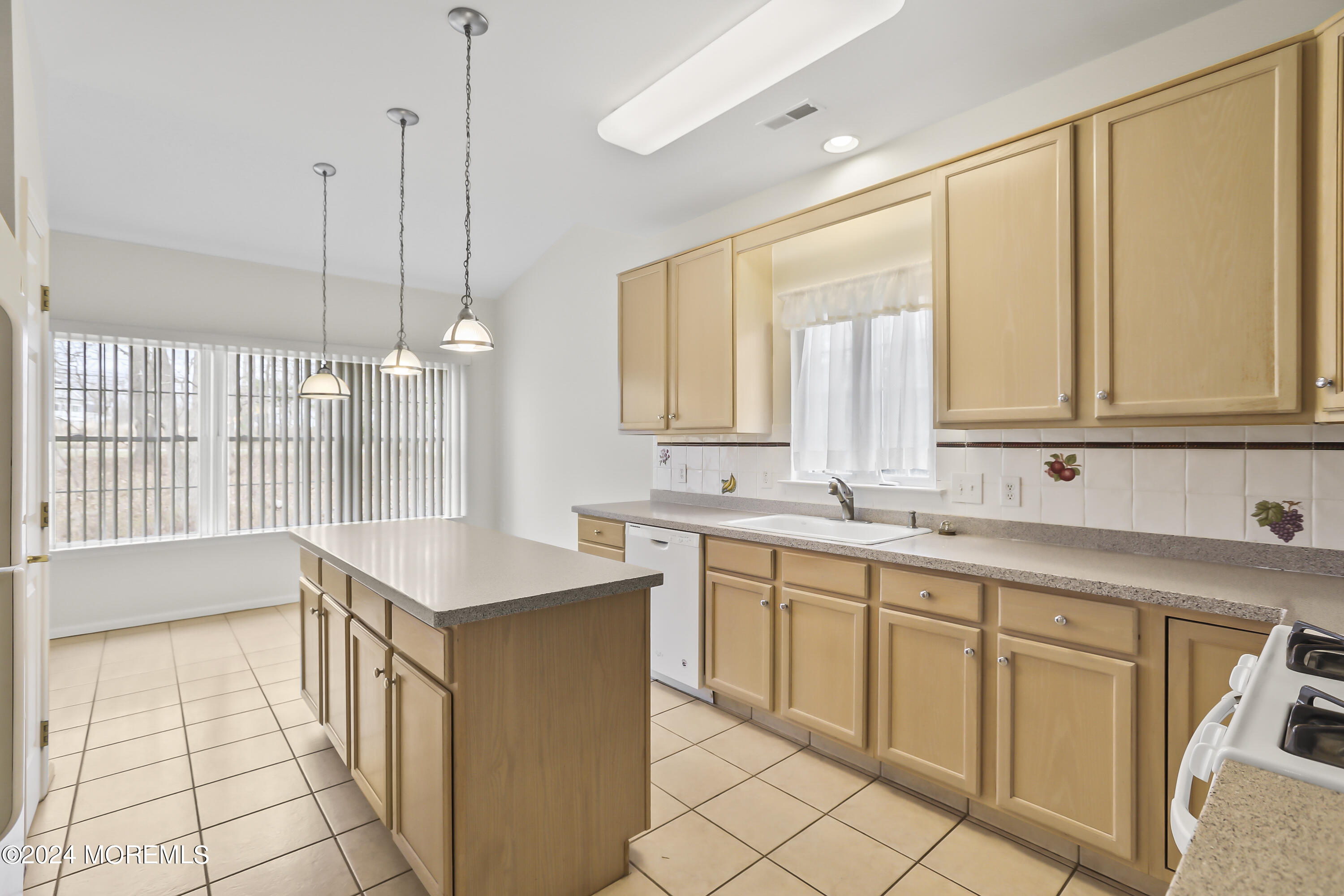 11 Rye Court Jackson, NJ 08527 - Photo 11 of 23 a kitchen with a sink window and cabinets