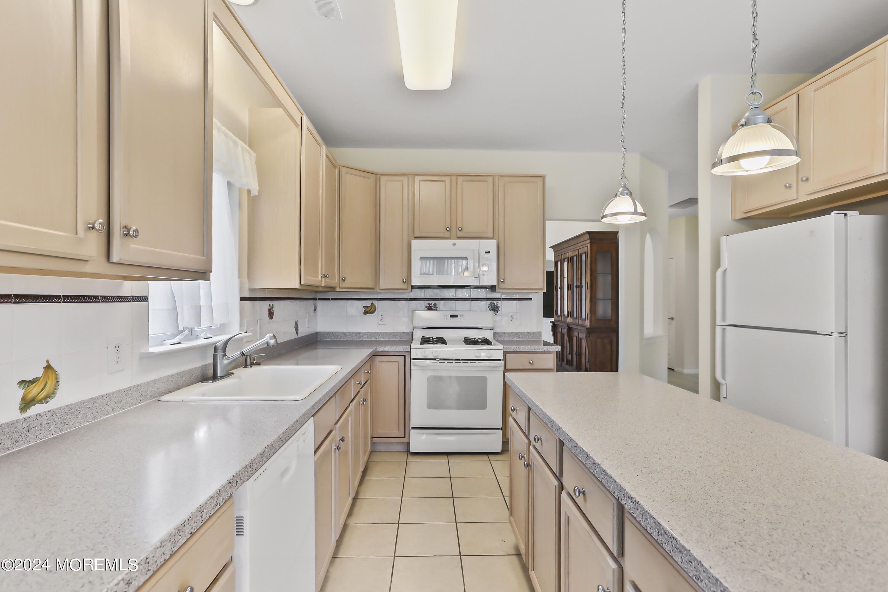 11 Rye Court Jackson, NJ 08527 - Photo 13 of 23 a kitchen with a sink stove and refrigerator