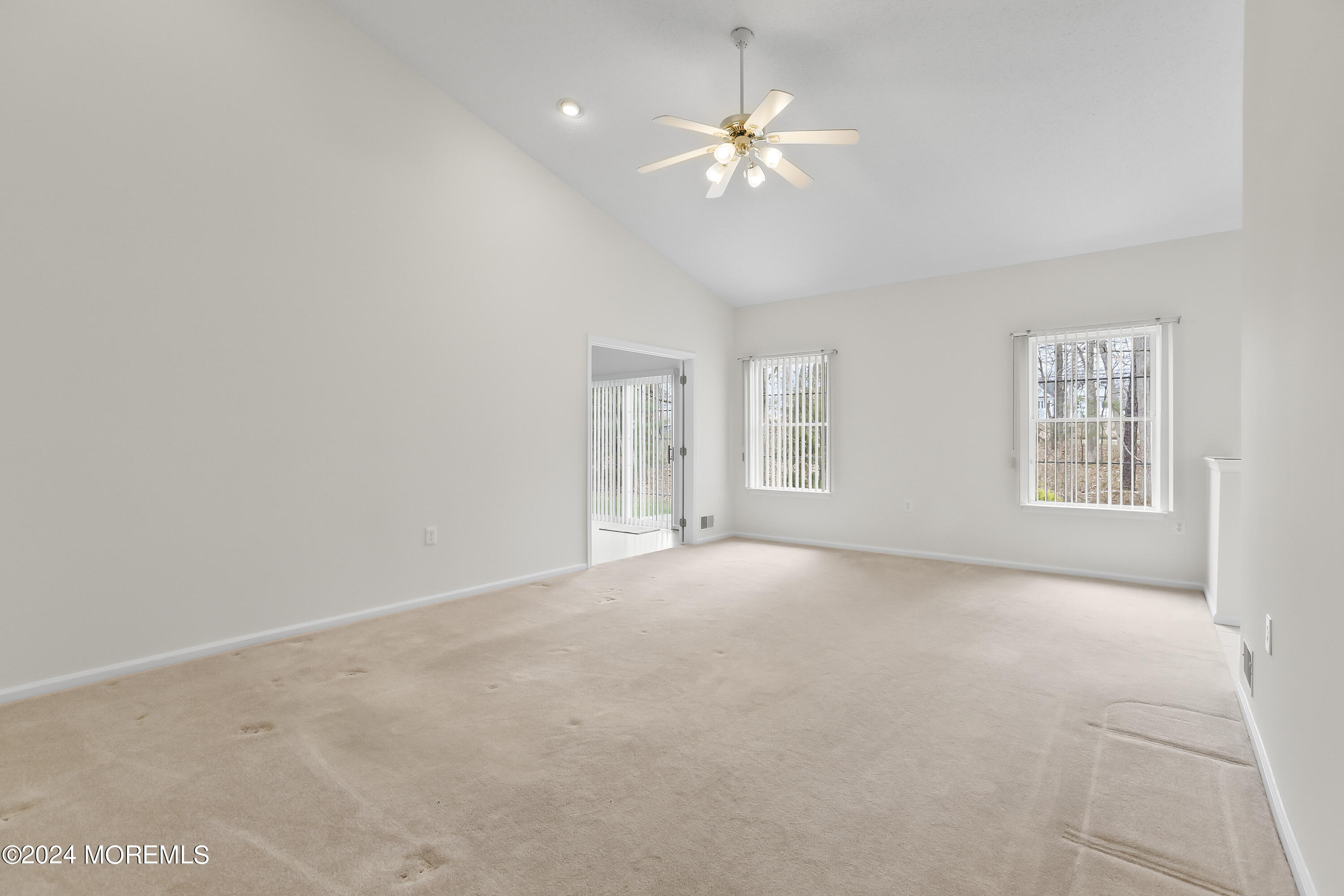 11 Rye Court Jackson, NJ 08527 - Photo 17 of 23 an empty room with chandelier fan and windows