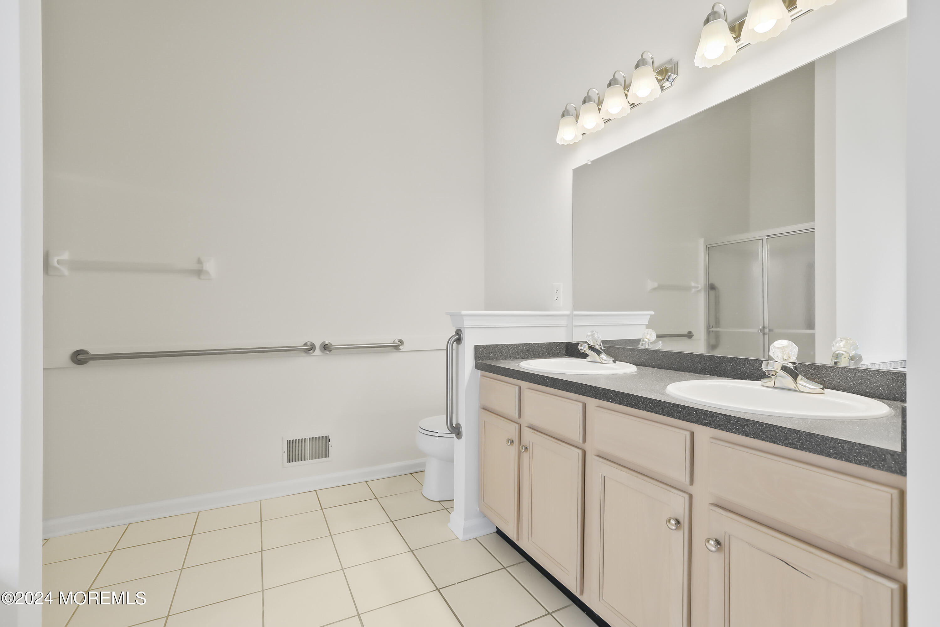 11 Rye Court Jackson, NJ 08527 - Photo 20 of 23 a bathroom with a sink vanity and a mirror