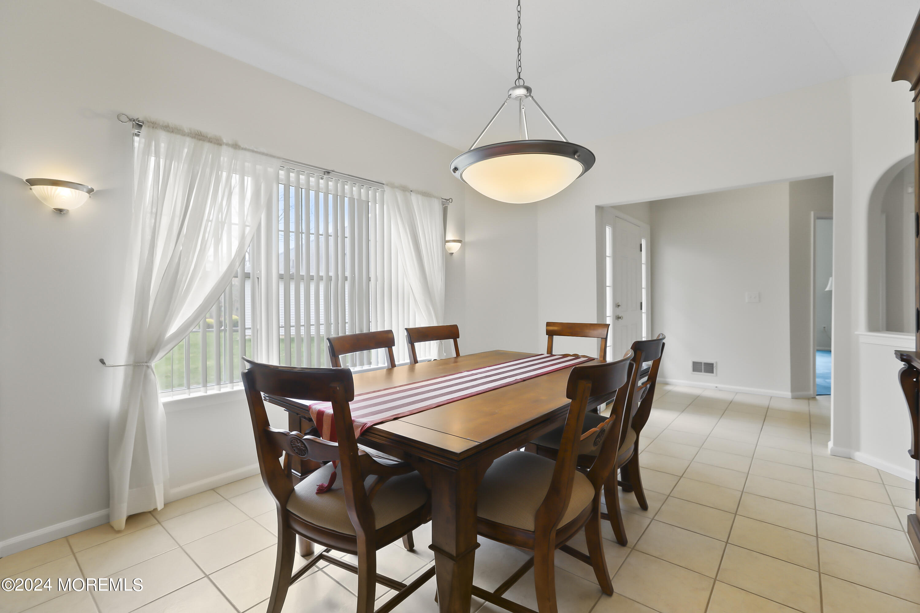 11 Rye Court Jackson, NJ 08527 - Photo 7 of 23 a view of a dining room with furniture and a window