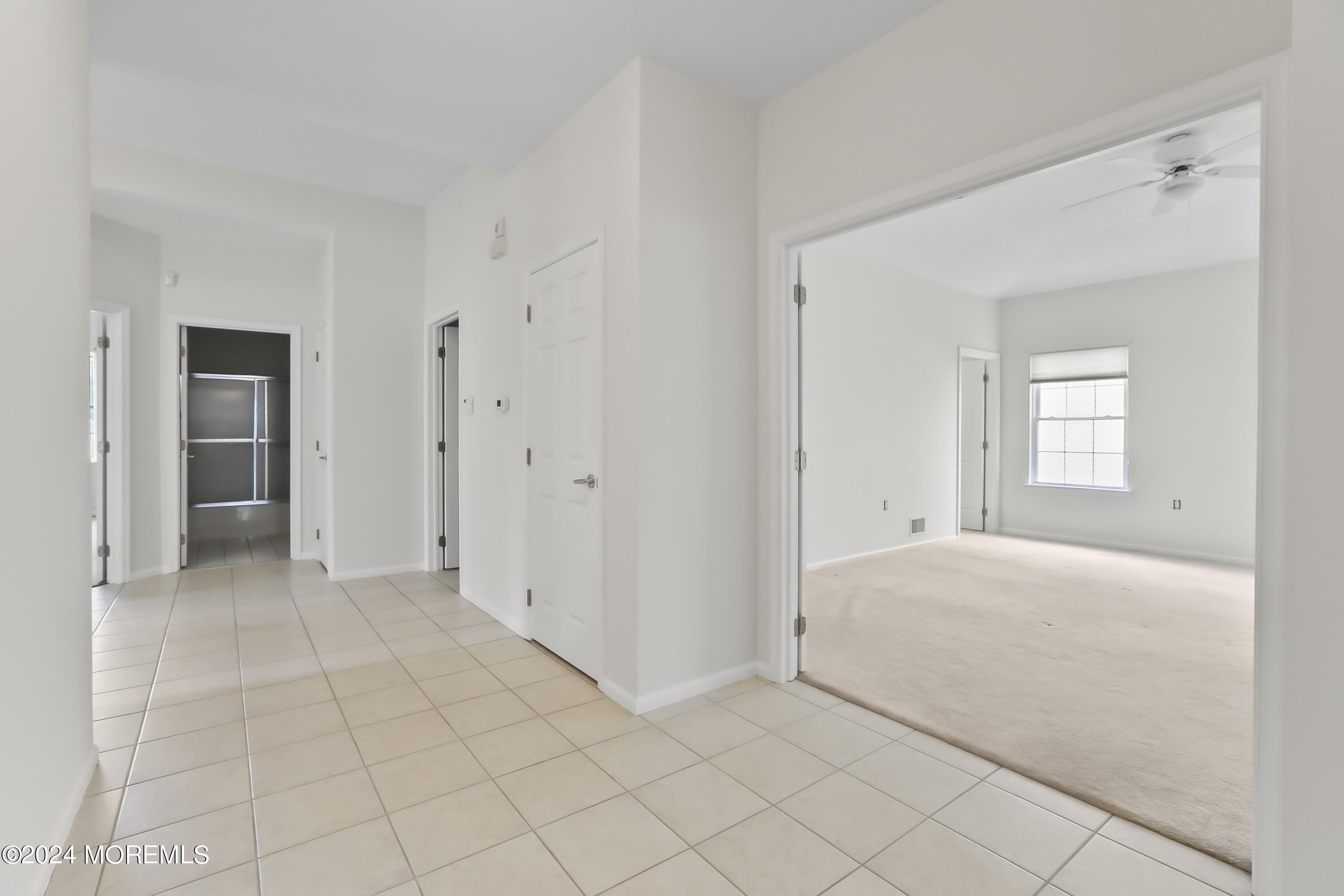 11 Rye Court Jackson, NJ 08527 - Photo 9 of 23 a view of a livingroom with a closet area and bedroom