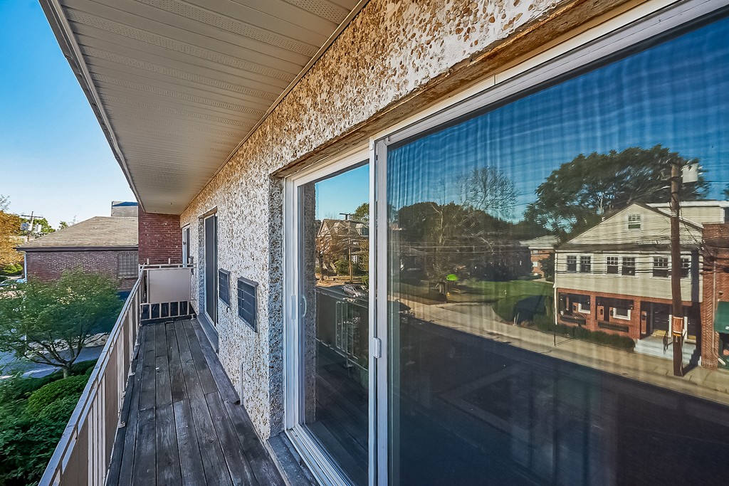 383 Langley Road, Unit 12 Newton, MA 02459 - Photo 9 of 12 a balcony view with a seating space