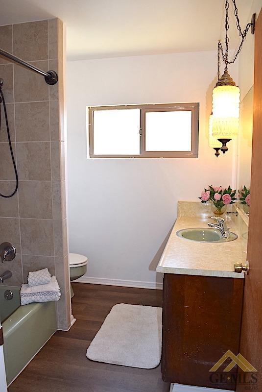 Undisclosed Address Bakersfield, CA 93305 - Photo 11 of 20 a bathroom with a sink a toilet and shower