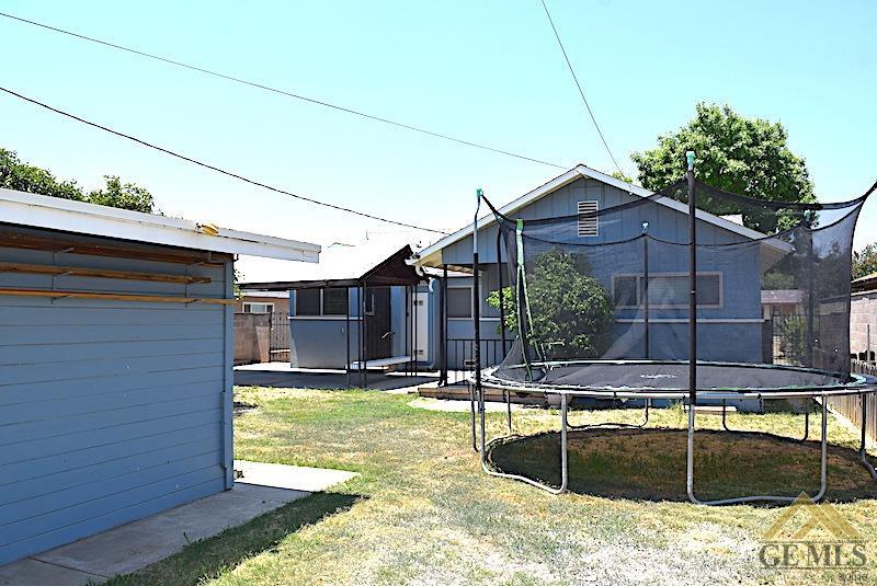 Undisclosed Address Bakersfield, CA 93305 - Photo 16 of 20 a view of a house with swimming pool