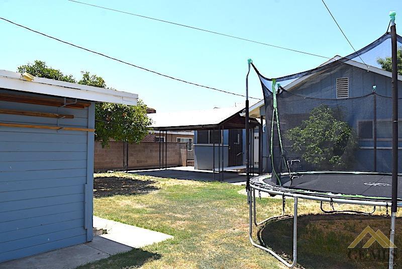 Undisclosed Address Bakersfield, CA 93305 - Photo 17 of 20 a view of a backyard with potted plants