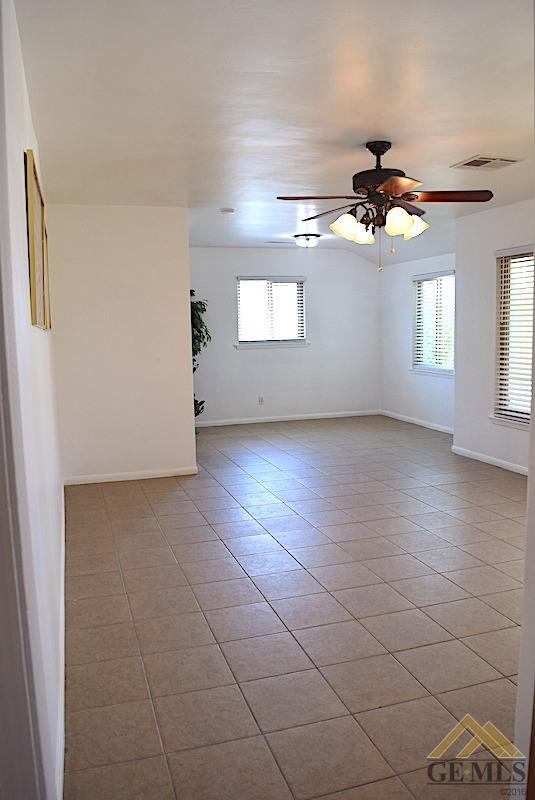 Undisclosed Address Bakersfield, CA 93305 - Photo 3 of 20 a view of an empty room with a window