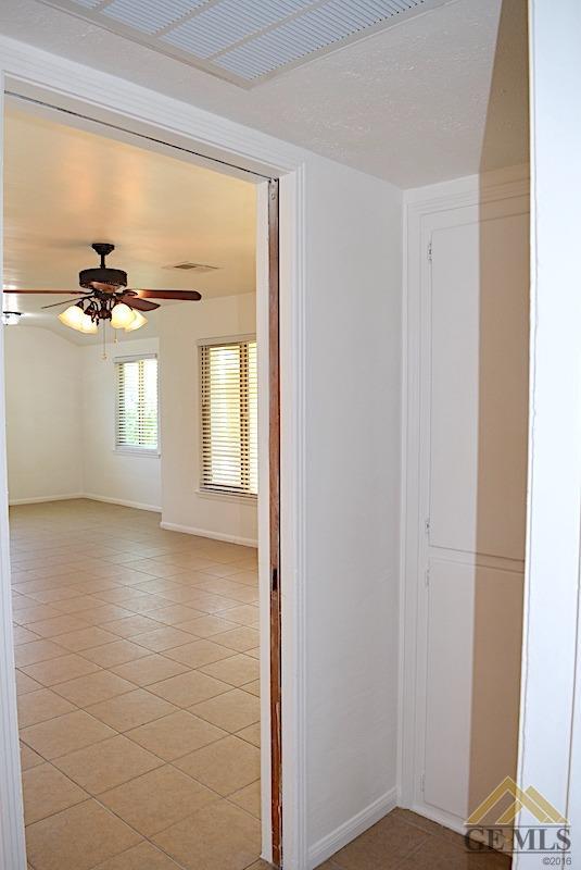 Undisclosed Address Bakersfield, CA 93305 - Photo 4 of 20 a view of an empty room with a window