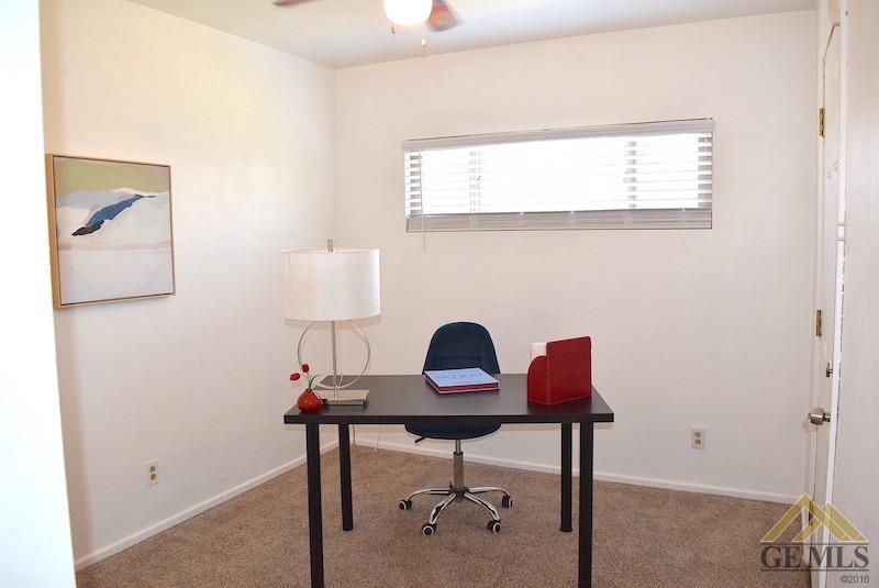 Undisclosed Address Bakersfield, CA 93305 - Photo 7 of 20 a workspace with furniture and a window