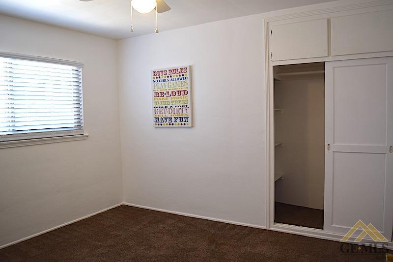 Undisclosed Address Bakersfield, CA 93305 - Photo 10 of 20 an empty room with a window