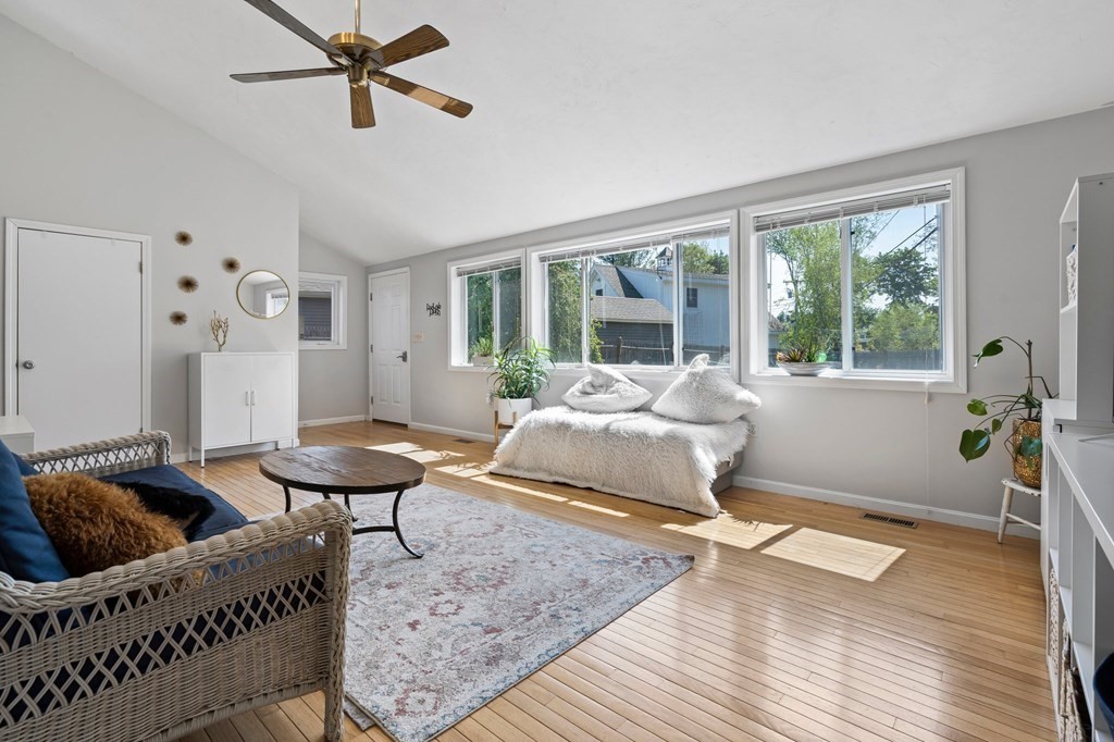 3 Bates Grove Road Webster, MA 01570 - Photo 19 of 40 a bedroom with a bed and wooden floor