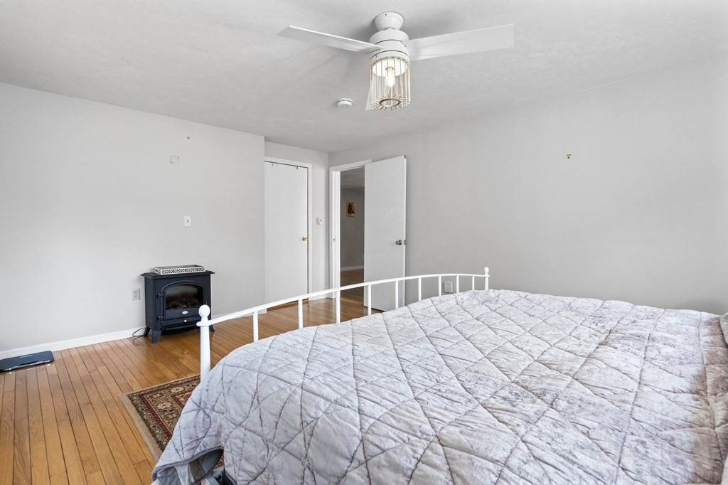 3 Bates Grove Road Webster, MA 01570 - Photo 25 of 40 a bedroom with a bed and a table