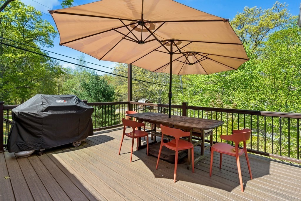 3 Bates Grove Road Webster, MA 01570 - Photo 5 of 40 a view of a balcony with furniture and wooden floor