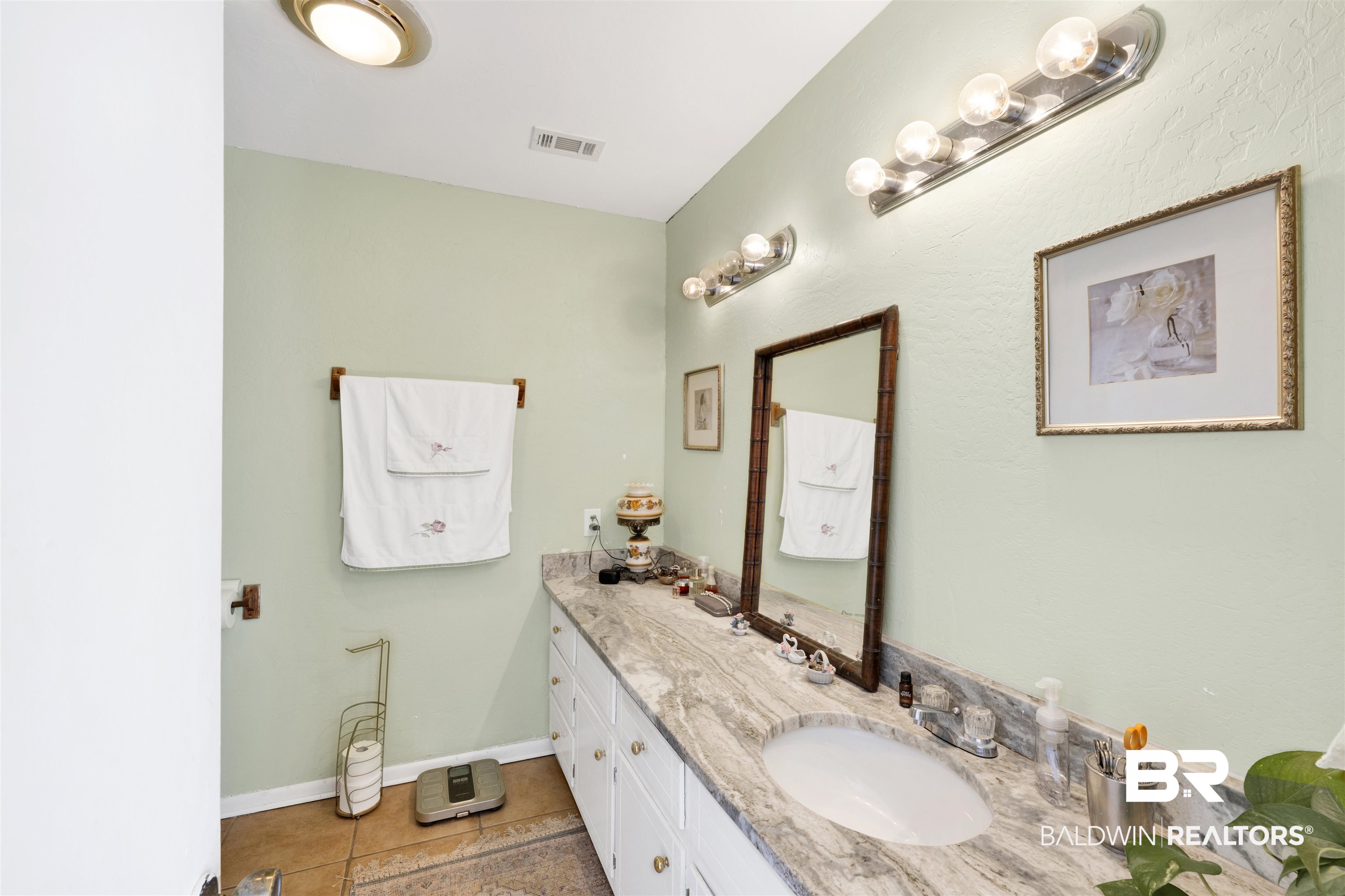 26222 Marina Road Orange Beach, AL 36561 - Photo 25 of 38 Bathroom featuring vanity and light tile patterned flooring
