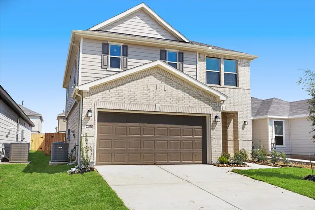a view of house with yard