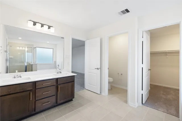 a bathroom with a bathtub sink and mirror