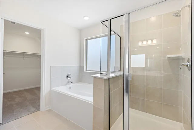 a white bath tub sitting next to a white sink