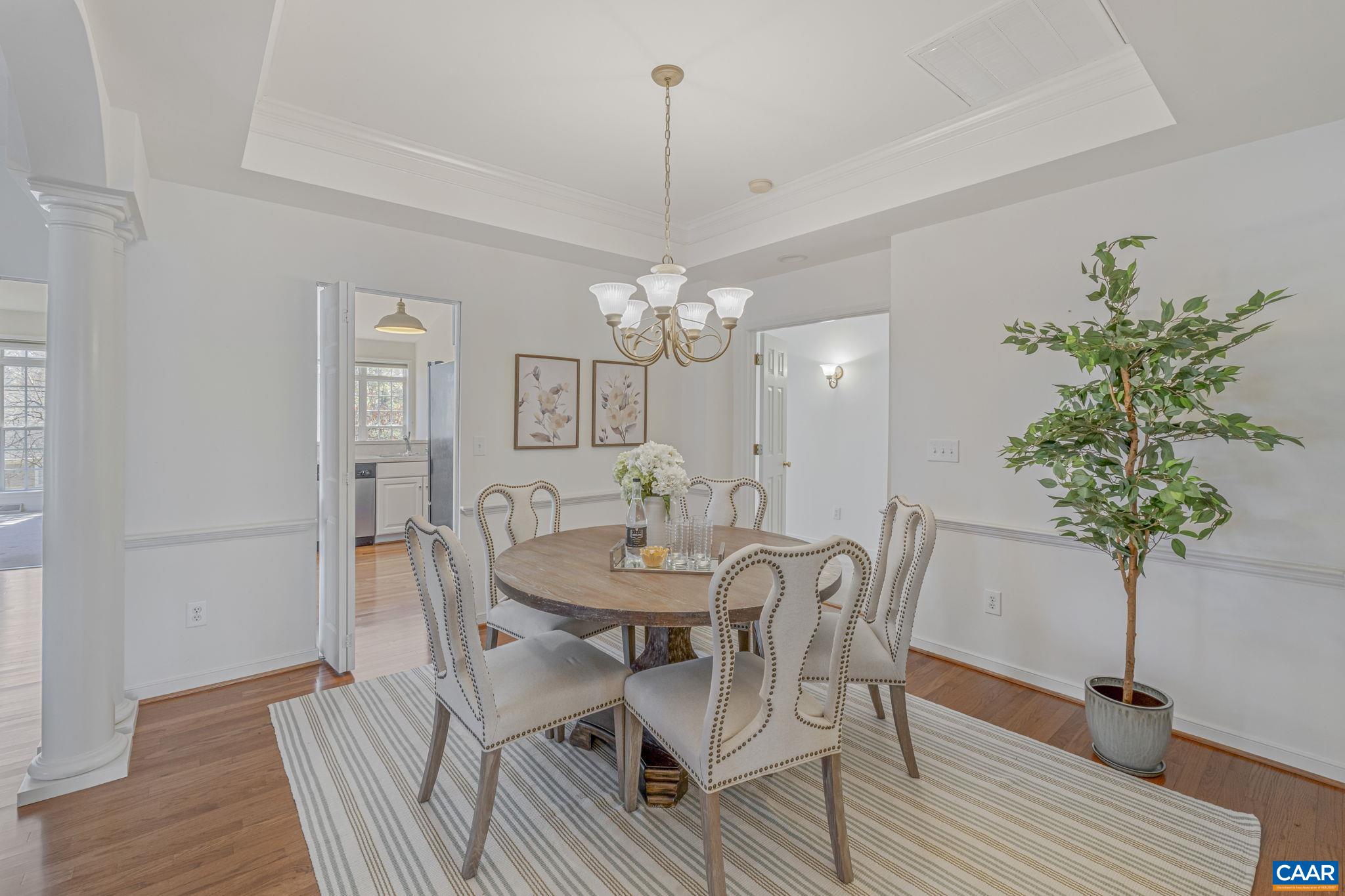 1347 Singleton Lane Charlottesville, VA 22903 - Photo 12 of 34 a view of a dining room with furniture and chandelier