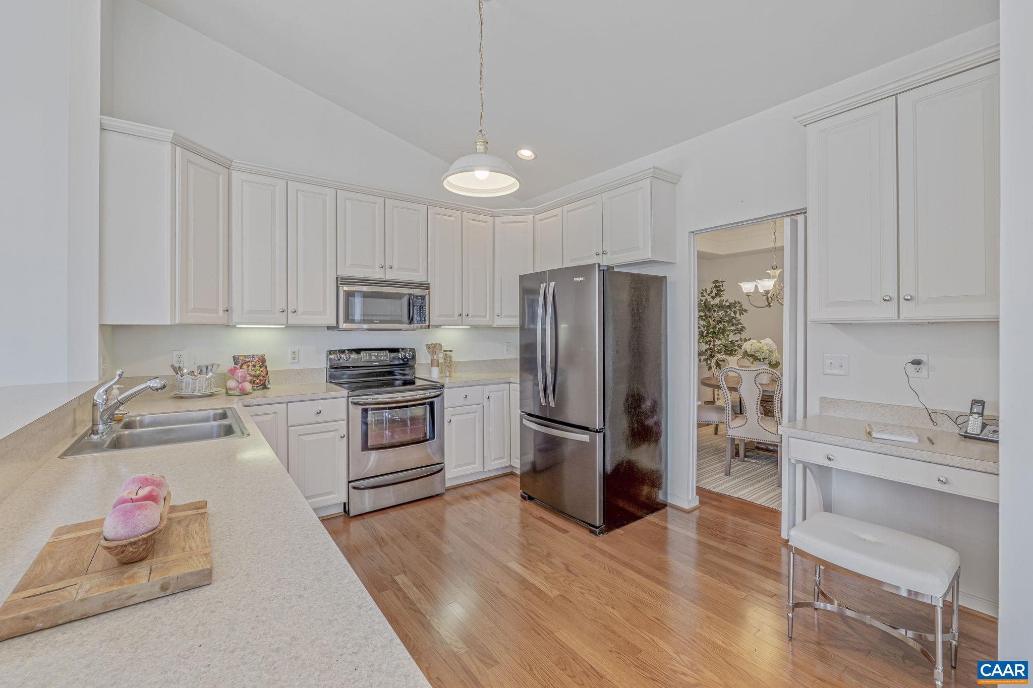 1347 Singleton Lane Charlottesville, VA 22903 - Photo 17 of 34 a kitchen with granite countertop stainless steel appliances and wooden cabinets