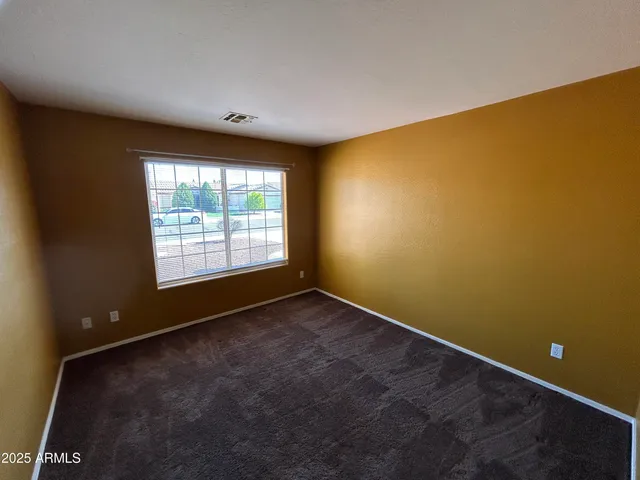 an empty room with a empty space and a window