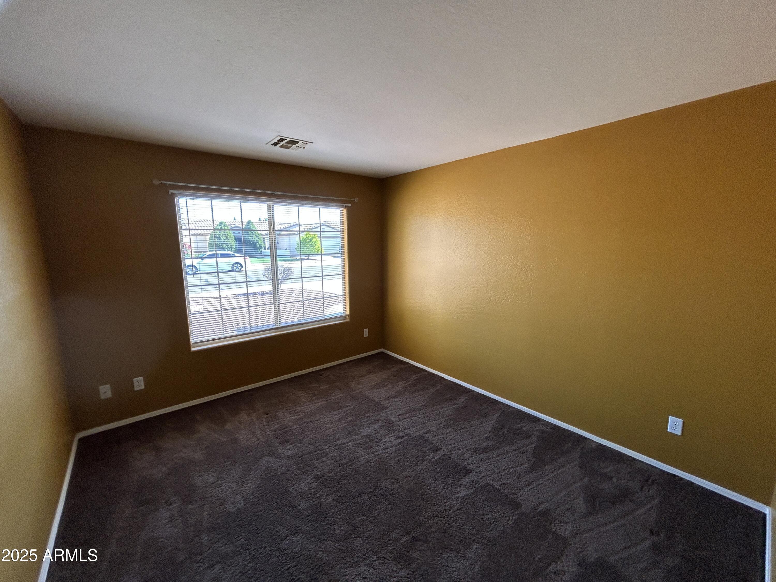 13444 West Paradise Lane Surprise, AZ 85374 - Photo 12 of 25 an empty room with a empty space and a window