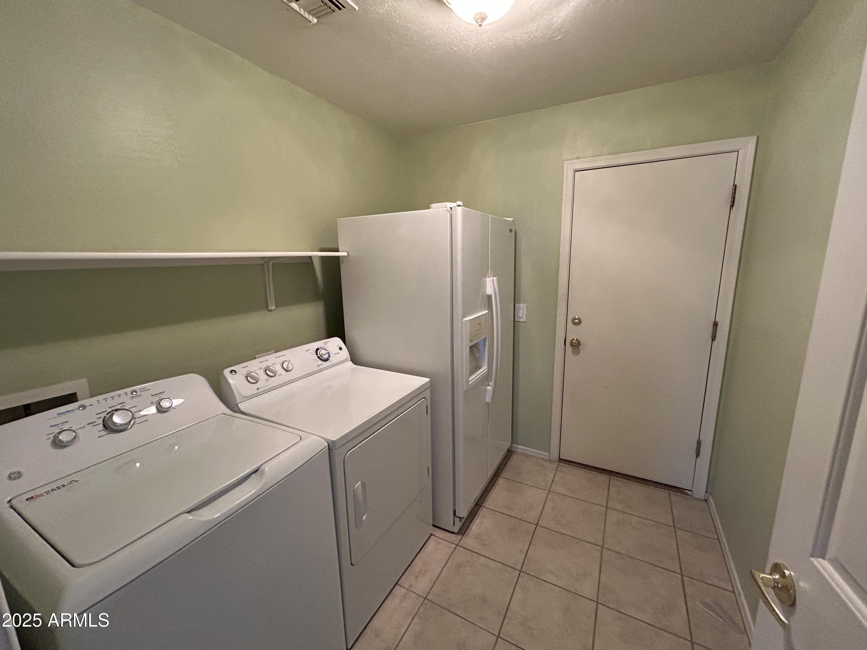 13444 West Paradise Lane Surprise, AZ 85374 - Photo 17 of 25 a utility room with dryer and washer
