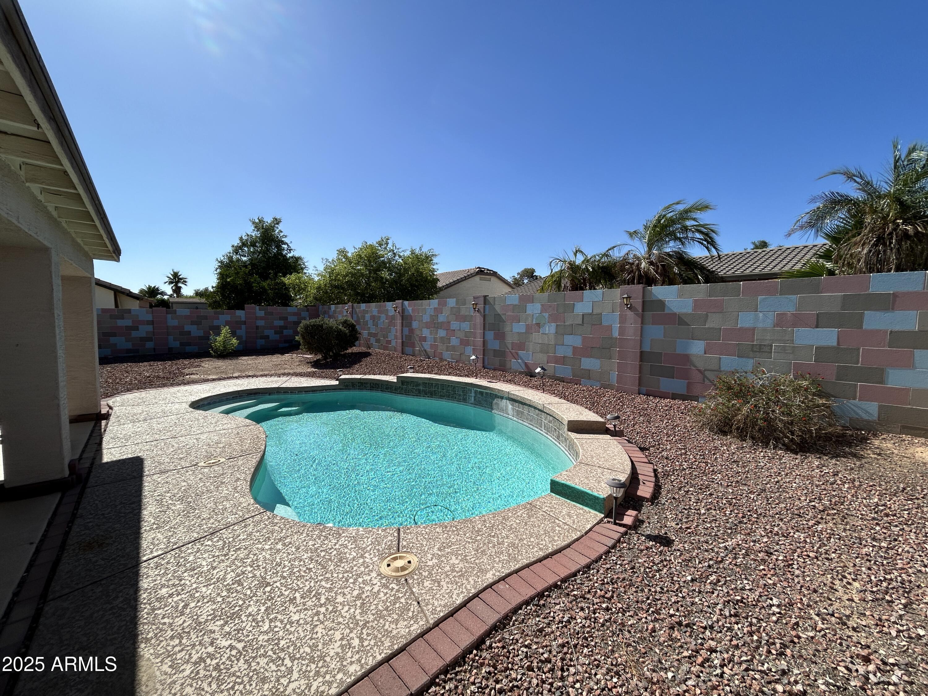 13444 West Paradise Lane Surprise, AZ 85374 - Photo 25 of 25 a view of a backyard with swimming pool