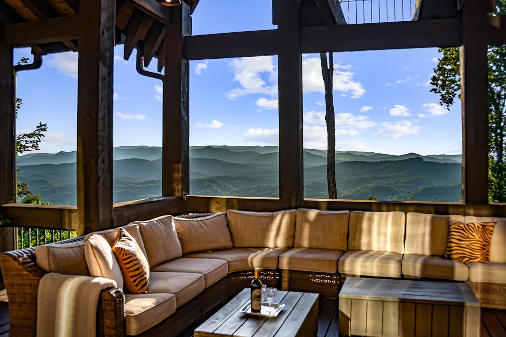 520 Overlook Drive Blue Ridge, GA 30513 - Photo 11 of 84 a living room with furniture and a floor to ceiling window