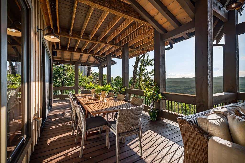520 Overlook Drive Blue Ridge, GA 30513 - Photo 14 of 84 a view of a patio with a table chairs and a backyard