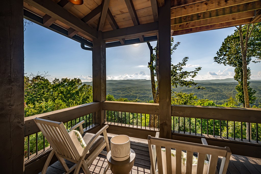 520 Overlook Drive Blue Ridge, GA 30513 - Photo 17 of 84 a view of a chair and table in the balcony